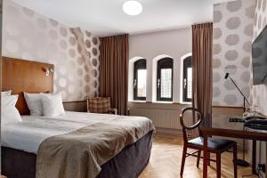 Postel nebo postele na pokoji v ubytování Best Western Plus Grand Hotel