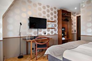 Postel nebo postele na pokoji v ubytování Best Western Plus Grand Hotel