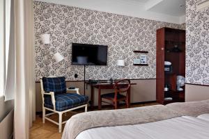 TV a/nebo společenská místnost v ubytování Best Western Plus Grand Hotel