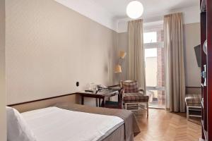 TV a/nebo společenská místnost v ubytování Best Western Plus Grand Hotel