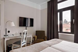TV a/nebo společenská místnost v ubytování Best Western Plus Grand Hotel