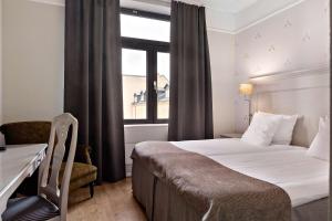 Postel nebo postele na pokoji v ubytování Best Western Plus Grand Hotel