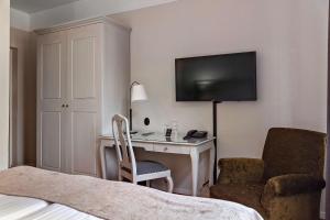 TV a/nebo společenská místnost v ubytování Best Western Plus Grand Hotel