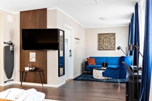 TV a/nebo společenská místnost v ubytování Best Western Hotel Savoy