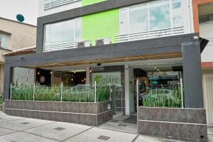 a store front of a building with plants in it at Hotel Volare in Armenia