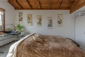 a bedroom with a large bed and a desk at Studio A mile from the best south Bay Beach in Redondo Beach