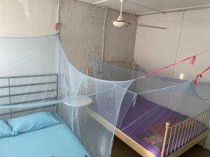 Postel nebo postele na pokoji v ubytování Voyage Guesthouse