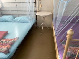Postel nebo postele na pokoji v ubytování Voyage Guesthouse