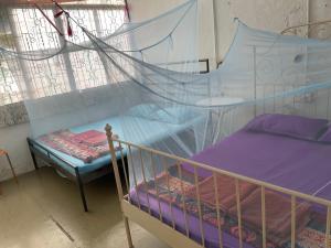 Postel nebo postele na pokoji v ubytování Voyage Guesthouse