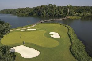 an overhead view of a golf course with a golfer on the green at Callaway Resort & Gardens in Pine Mountain