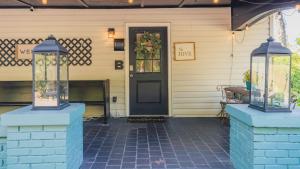 a front door of a house with a black door at King bed open floorplan in heart of Bham in Birmingham
