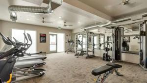 a gym with several treadmills and bikes in it at Gym❂Conference Room❂Desk ❂Mtn/Pool View in Salt Lake City