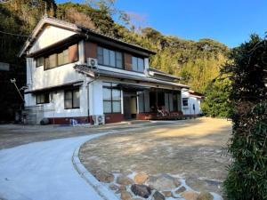 a house with a road in front of it at I,K,I HOUSE TSURUKIFURE - Vacation STAY 14773v in Iki