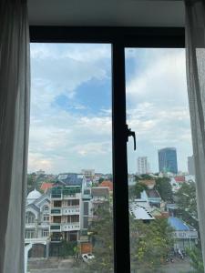 a view of a city from a window at BĂNG BOUTIQUE HOTEL in Thu Dau Mot