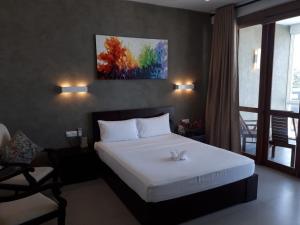 Postel nebo postele na pokoji v ubytování White Sand Villa - Beach front