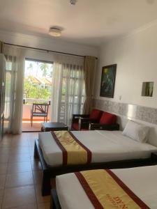 Postel nebo postele na pokoji v ubytování DYNASTY MUINE RESORT