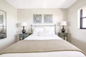 a bedroom with a large bed with two night stands at Gulf Escape in Clearwater Beach