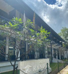 a building with a sign in front of it at Hotel Randiya in Anuradhapura