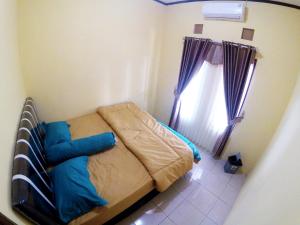 Katil atau katil-katil dalam bilik di Menayu Homestay