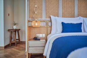 Postel nebo postele na pokoji v ubytování Royal Avila Boutique Resort