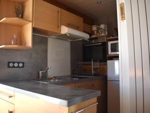 a kitchen with a sink and a counter top at Chalet Font-Romeu-Odeillo-Via, 5 pièces, 6 personnes - FR-1-580-39 in Font-Romeu-Odeillo-Via