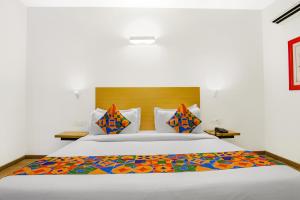 Postel nebo postele na pokoji v ubytování FabHotel Infinity Stays