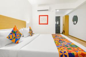 Postel nebo postele na pokoji v ubytování FabHotel Infinity Stays + 21 fotografií