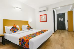Postel nebo postele na pokoji v ubytování FabHotel Infinity Stays
