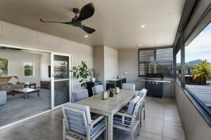 a dining room with a table and chairs at Wingham Motel in Wingham