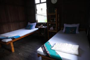 Postel nebo postele na pokoji v ubytování Baan Chi Homestay