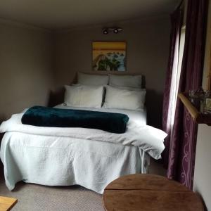 Voodi või voodid majutusasutuse Tahakopa Lodge - Cabin toas