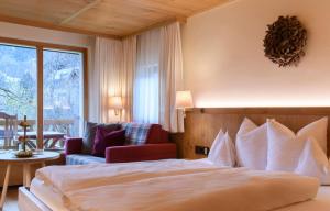 Postel nebo postele na pokoji v ubytování Hotel Montafoner Hof