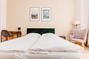 Postel nebo postele na pokoji v ubytování Riben House Prague