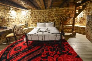 Postel nebo postele na pokoji v ubytování Ξενώνας Νικόλ