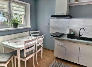 Kuchyň nebo kuchyňský kout v ubytování Apartament Za Potokiem