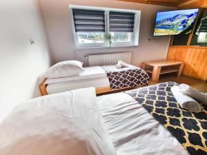 Postel nebo postele na pokoji v ubytování Apartament Za Potokiem