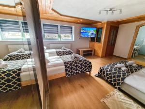 Postel nebo postele na pokoji v ubytování Apartament Za Potokiem
