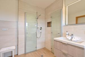 a bathroom with a shower and a sink at Landhaus am See Appartement LH 1 in Schwangau