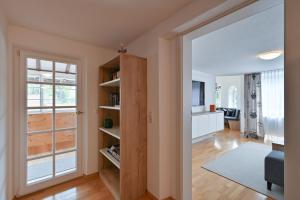 an open living room with a sliding door and a living room at Ferienwohnung Sophia in Pfronten