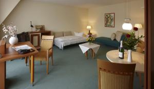 Кровать или кровати в номере Grothenns Hotel 3-Sterne superior