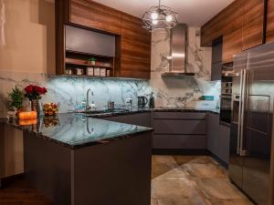 a kitchen with a large marble counter top at Apartamenty u Słodyczki in Mizerna