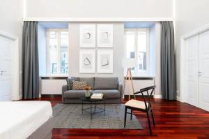 a living room with a couch and a table at Croce Apartments in Rome