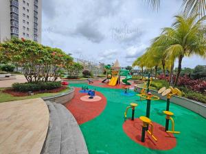 a playground in a resort with a slide at Amberside, Country Garden Danga Bay Homestay by WELCOME HOME in Johor Bahru