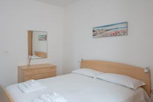 a bedroom with a bed with two towels on it at Vallevo 42 - YourPlace Abruzzo in San Vito Chietino