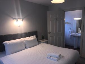Posteľ alebo postele v izbe v ubytovaní Atlantic Hotel