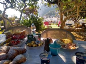 a table with a bunch of food on it at Soleluna in Capri