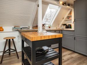 a kitchen with a island in the middle of a room at 5 person holiday home in Roslev in Roslev