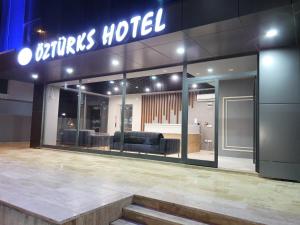 a store front of a store with chairs in it at ÖZTÜRKS HOTEL in Istanbul