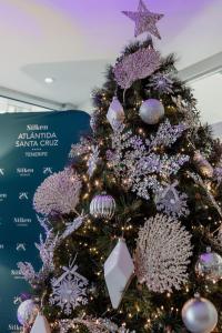 a christmas tree with purple and silver ornaments at Silken Atlántida Santa Cruz in Santa Cruz de Tenerife