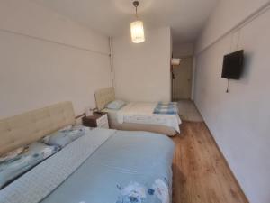 Postel nebo postele na pokoji v ubytování Thermal Orkide Pansiyon